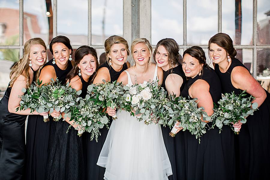 bridesmaids in black dress at the mill & mine