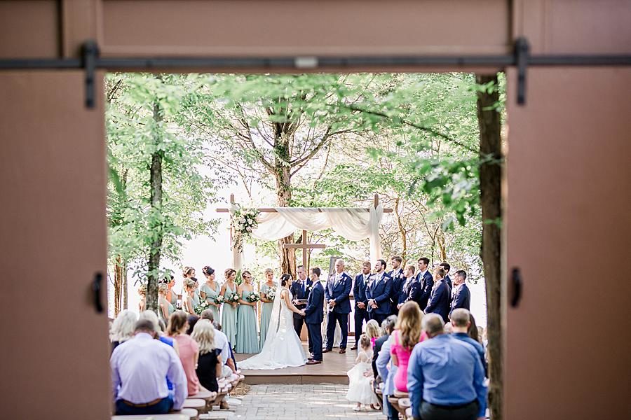 Ceremony on the water at this pavilion wedding by Knoxville Wedding Photographer, Amanda May Photos.