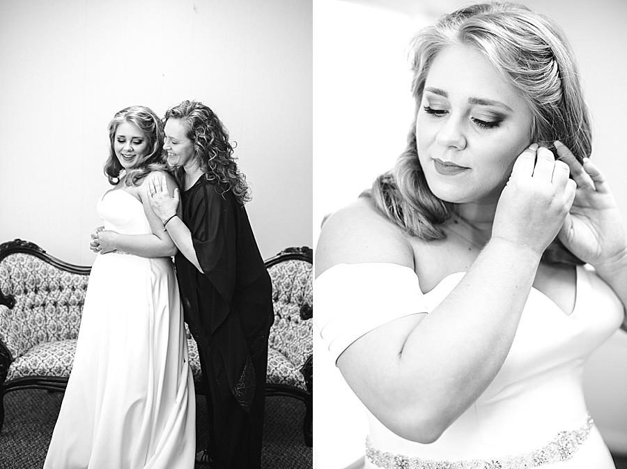 Putting in earrings at this Pine Ridge Baptist Church wedding by Knoxville Wedding Photographer, Amanda May Photos.