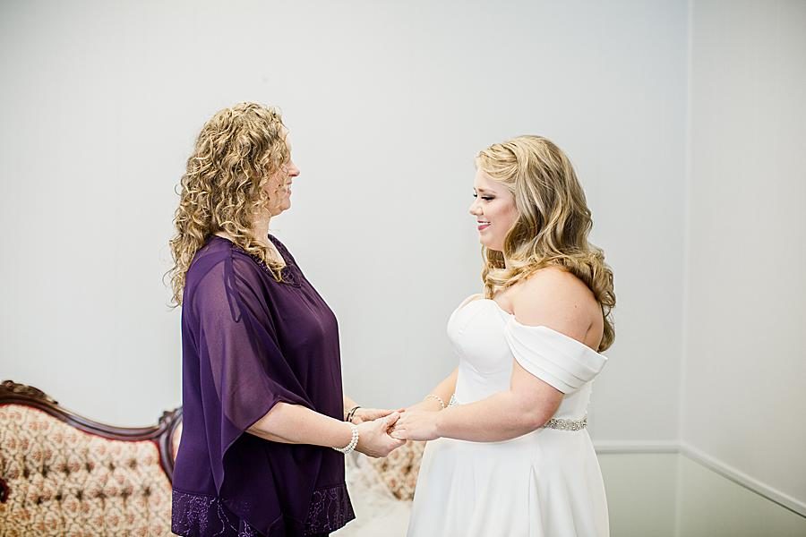 Mom holding daughter's hands at this Pine Ridge Baptist Church wedding by Knoxville Wedding Photographer, Amanda May Photos.