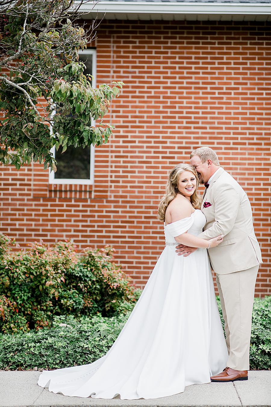 Nuzzling at this Pine Ridge Baptist Church wedding by Knoxville Wedding Photographer, Amanda May Photos.