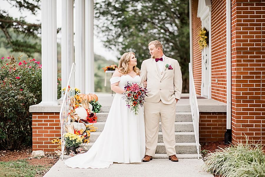 Looking at each other at this Pine Ridge Baptist Church wedding by Knoxville Wedding Photographer, Amanda May Photos.