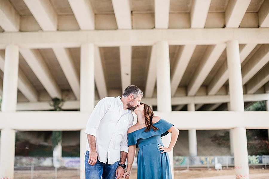 Kisses at this Printshop Brewery engagement by Knoxville Wedding Photographer, Amanda May Photos.