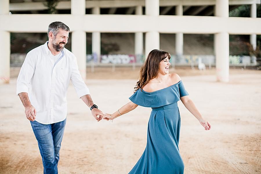 Walking at this Printshop Brewery engagement by Knoxville Wedding Photographer, Amanda May Photos.