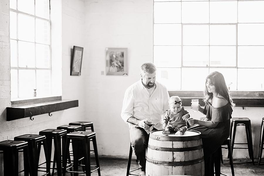 Baby on a whiskey barrel at this Printshop Brewery engagement by Knoxville Wedding Photographer, Amanda May Photos.