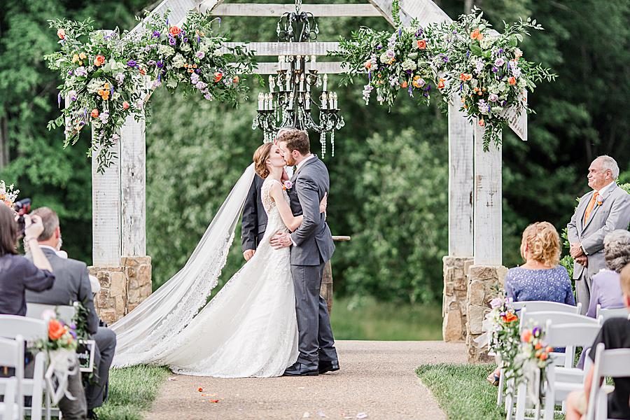 You may kiss the bride at this Ramble Creek Vineyard Wedding by Knoxville Wedding Photographer, Amanda May Photos.