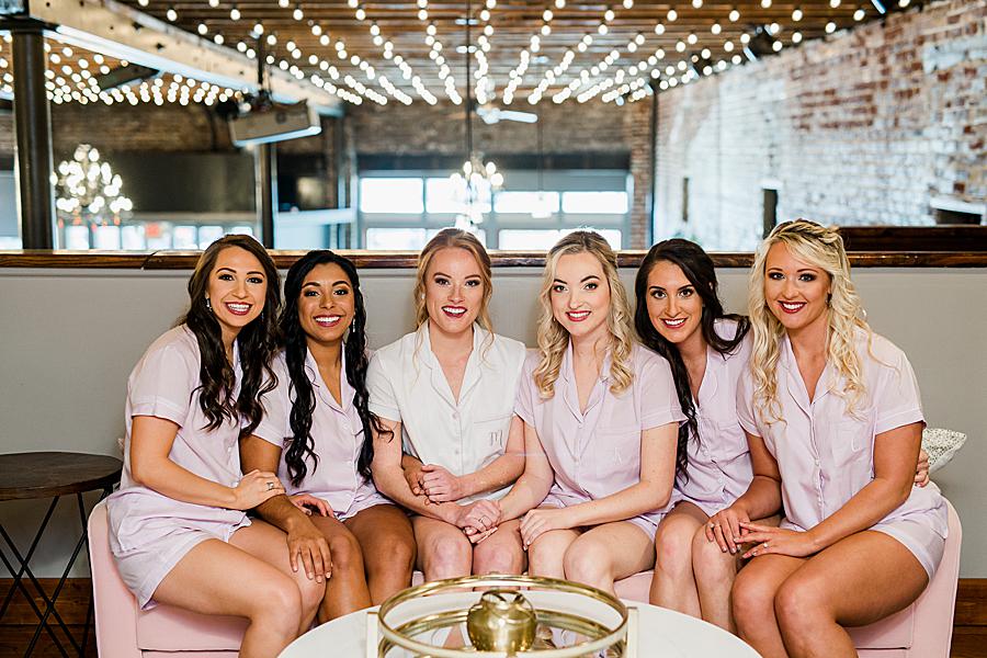 bride and bridesmaids in matching silk robes