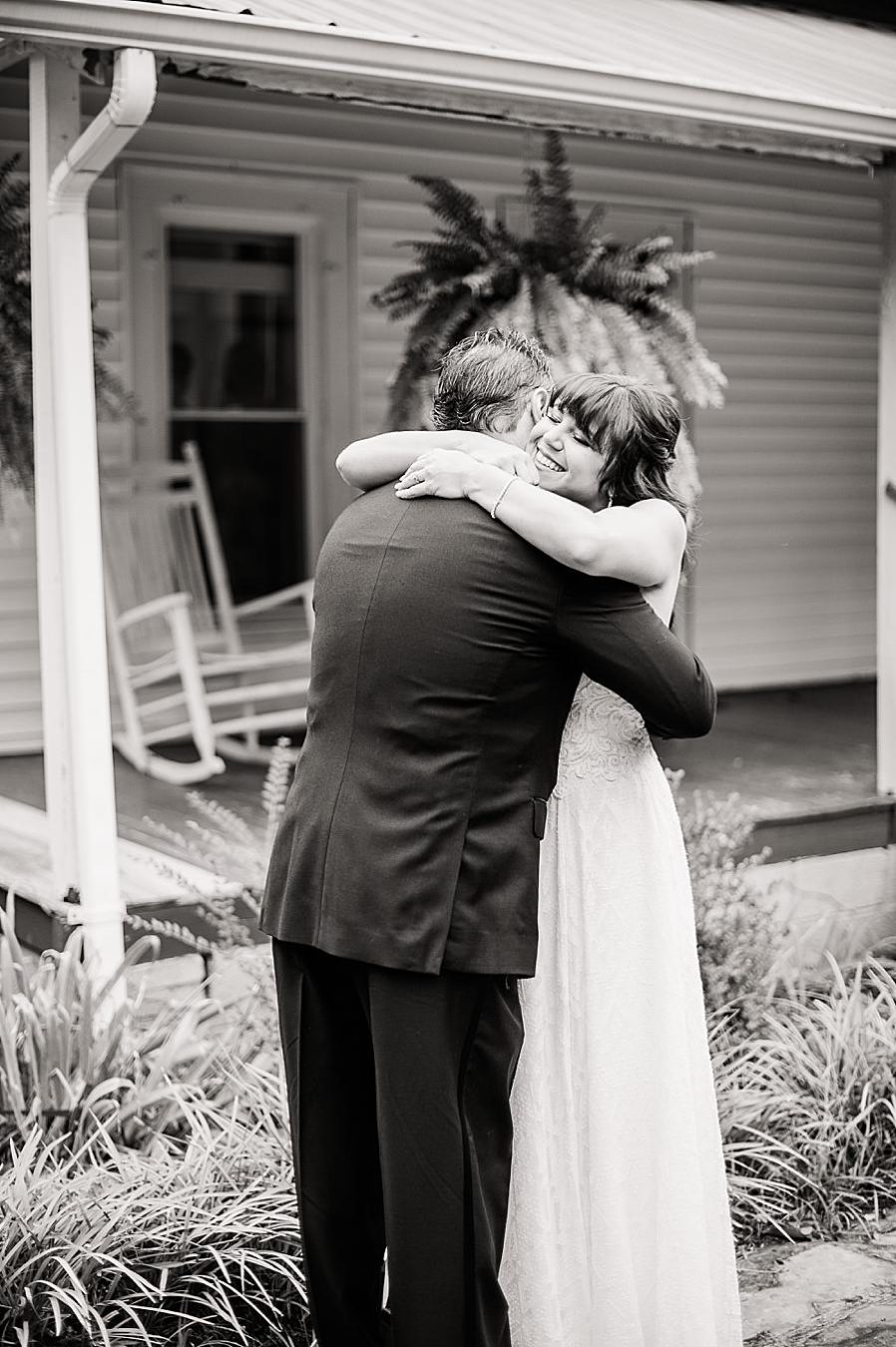 Hugging dad at this RiverView Family Farm wedding by Knoxville Wedding Photographer, Amanda May Photos.