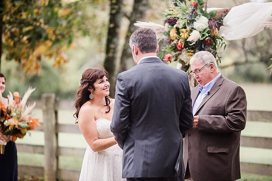 Exchanging rings at this RiverView Family Farm wedding by Knoxville Wedding Photographer, Amanda May Photos.