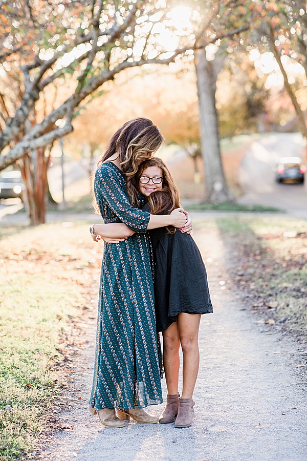 mom hugging daughter