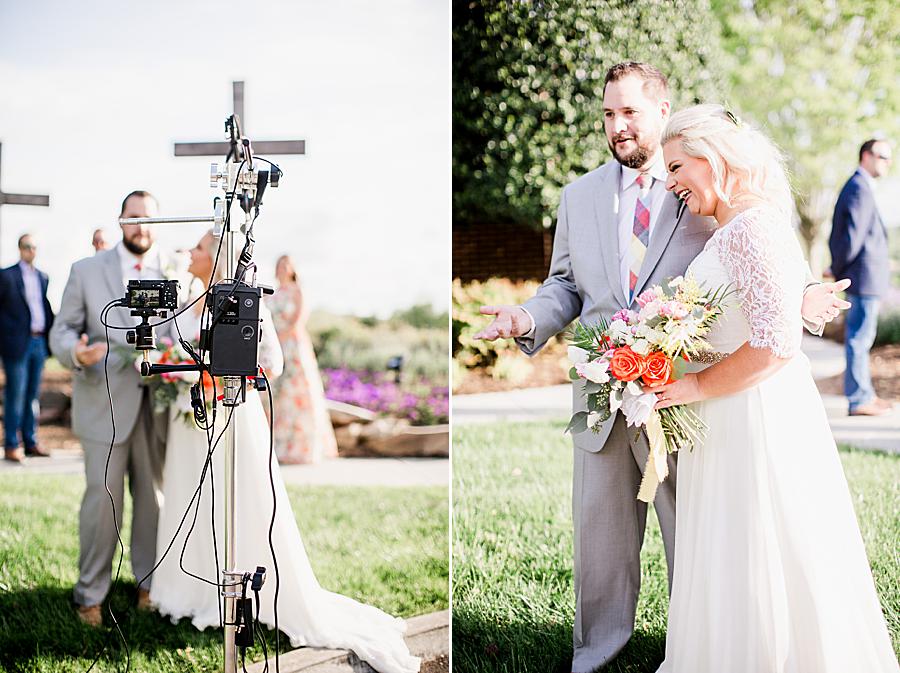 bride and groom in front of streaming equipment at shoreline elopement
