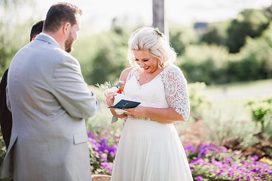 bride reading vows from special book