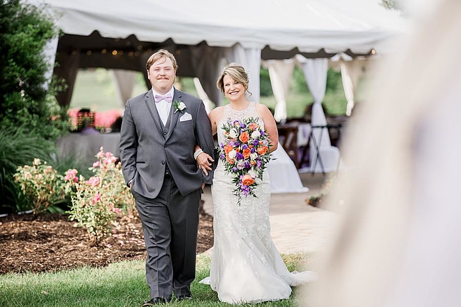 Son escorting mom down the aisle at this intimate WindRiver wedding by Knoxville Wedding Photographer Amanda May Photos.