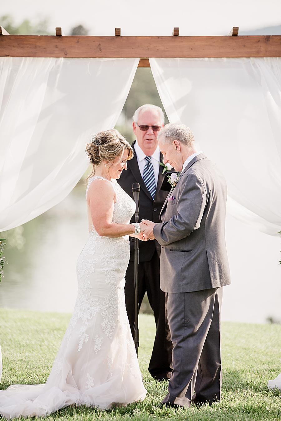 Exchanging rings at this intimate WindRiver wedding by Knoxville Wedding Photographer Amanda May Photos.