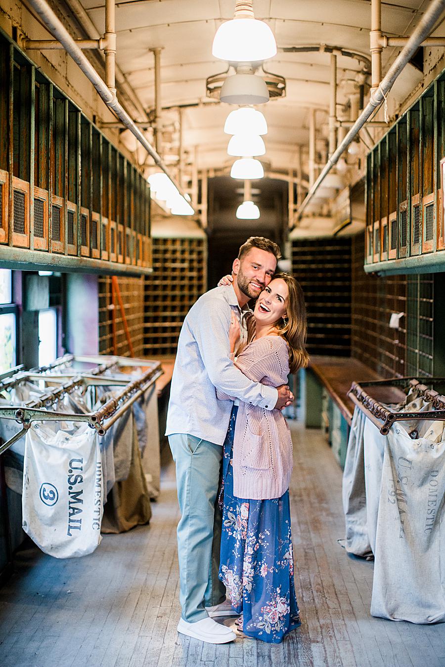 Cheeks together at this Southern Railway Station Engagement by Knoxville Wedding Photographer, Amanda May Photos.