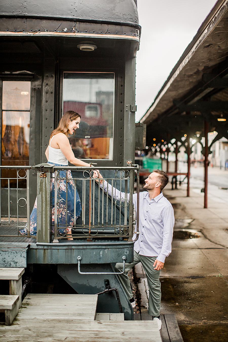 On a train at this Southern Railway Station Engagement by Knoxville Wedding Photographer, Amanda May Photos.