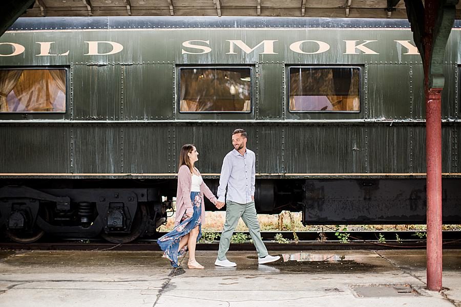 Walking at this Southern Railway Station Engagement by Knoxville Wedding Photographer, Amanda May Photos.