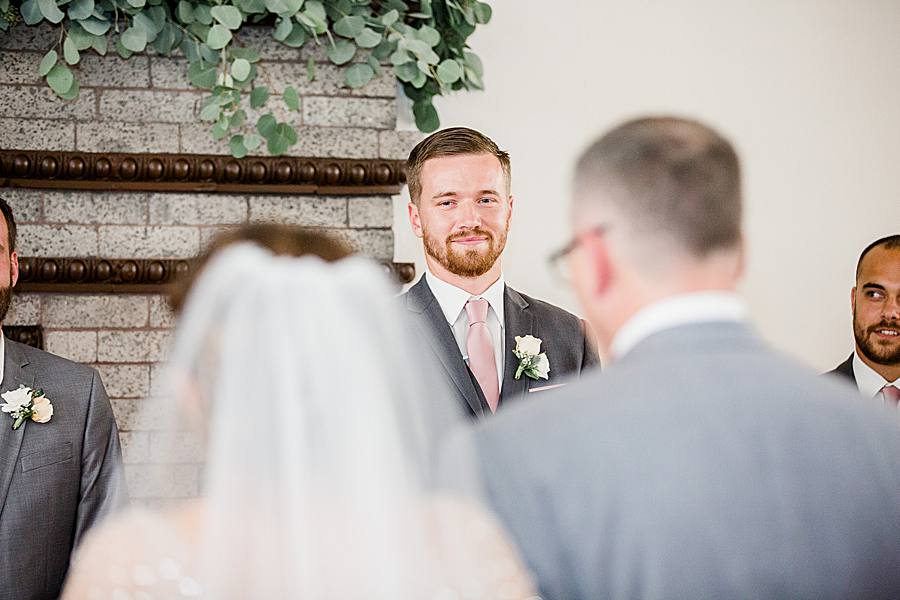 groom looking at bride 