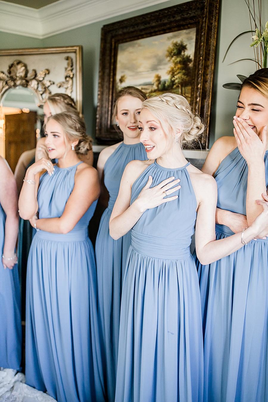 bridesmaid reaction to bride at spring wedding at castleton