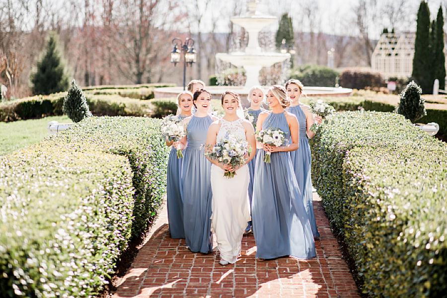 bride and bridesmaids walking together
