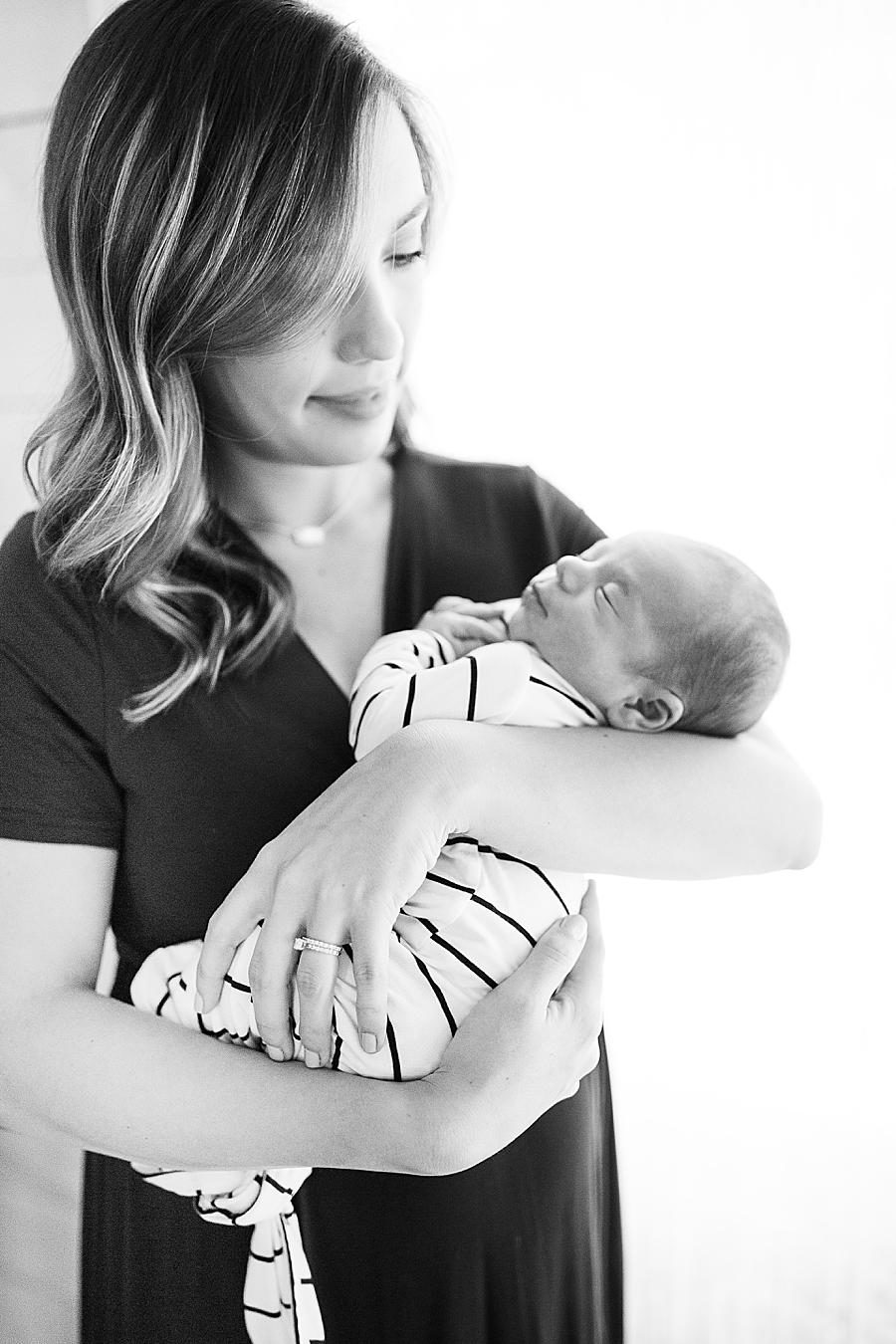 black and white picture of mom and baby at the studio