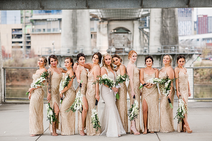 glittery bridesmaids at the bridge building