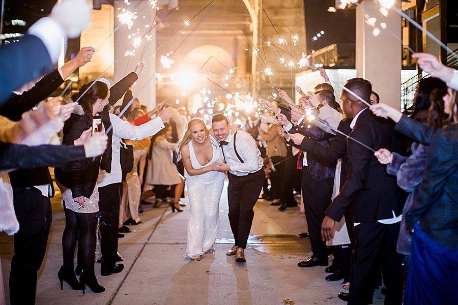 bride and groom sparkler exit at the bridge building