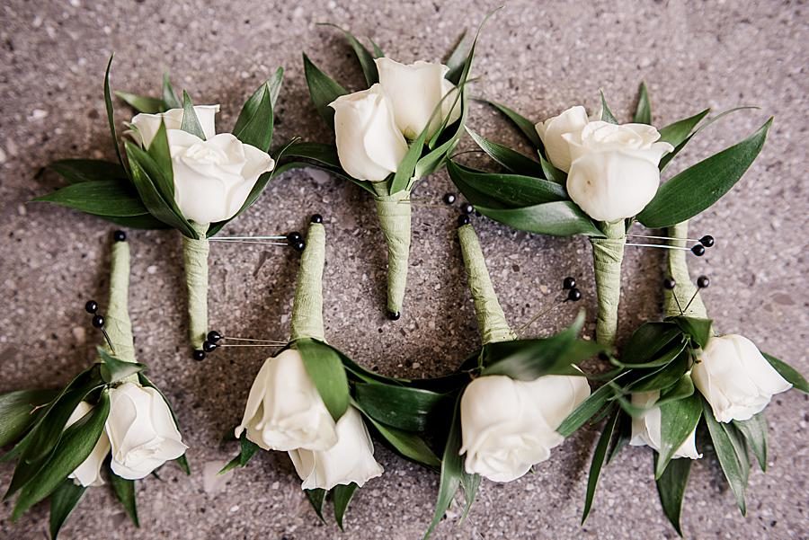 Rose boutonnieres at this The Press Room Wedding by Knoxville Wedding Photographer, Amanda May Photos.