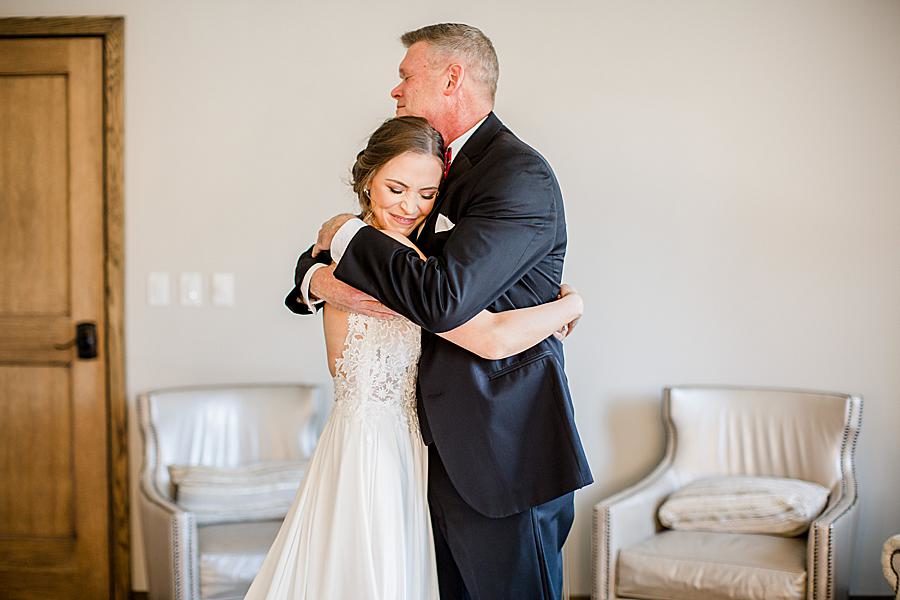 Hugging dad at this The Press Room Wedding by Knoxville Wedding Photographer, Amanda May Photos.