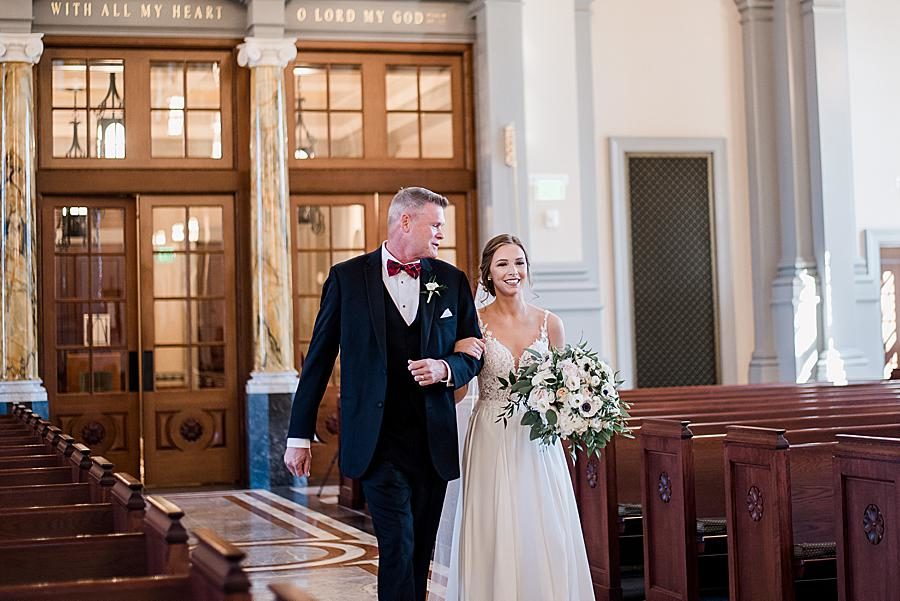 Walking down the aisle at this The Press Room Wedding by Knoxville Wedding Photographer, Amanda May Photos.