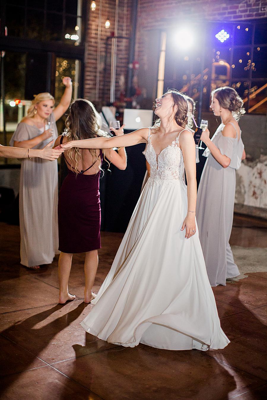 Bride dancing by Knoxville Wedding Photographer, Amanda May Photos.