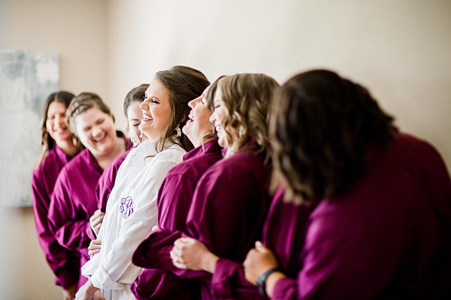 bridal party in matching plum robes