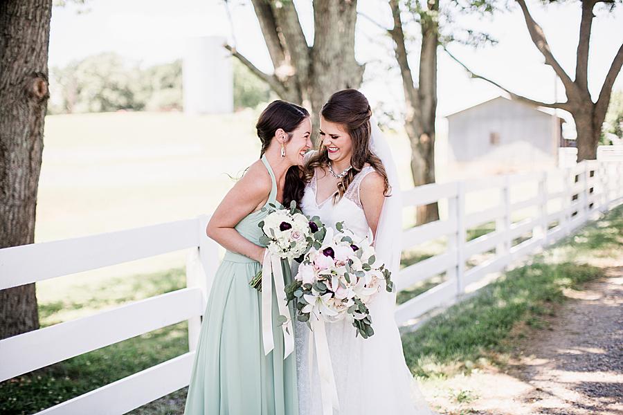 bride and maid of honor at the white rose
