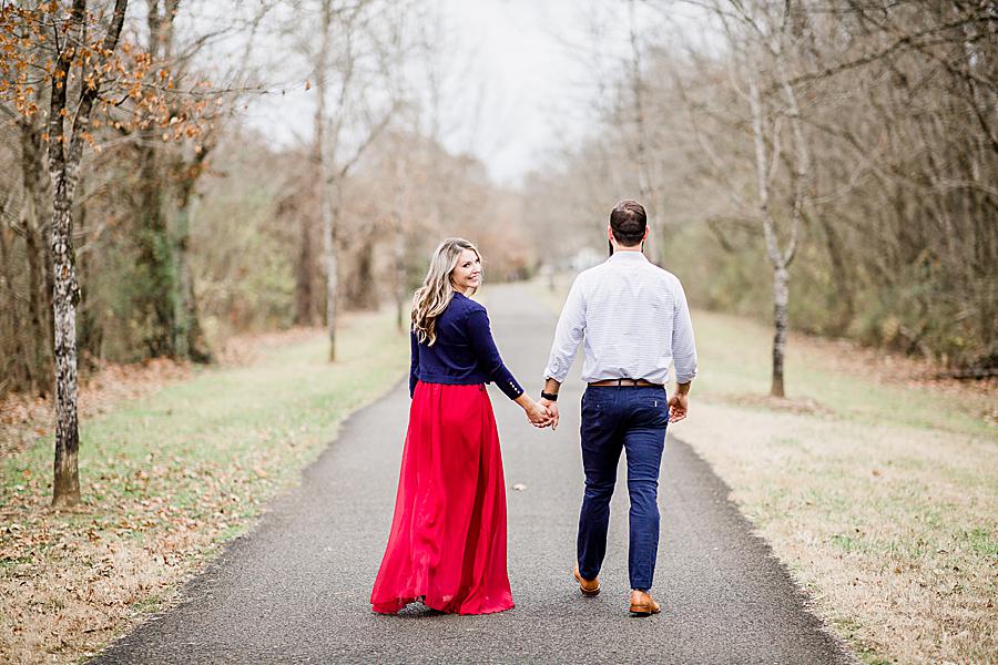Holding hands at this Third Creek Greenway by Knoxville Wedding Photographer, Amanda May Photos.