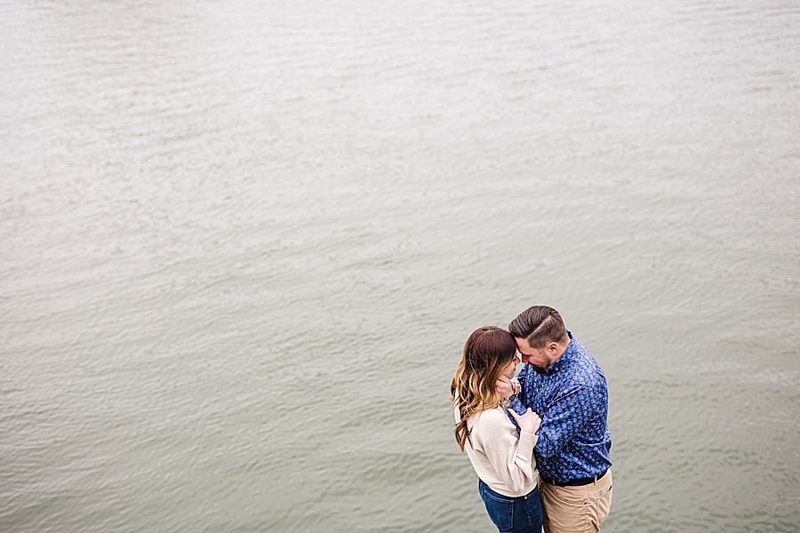 couple by the river at urban engagement session
