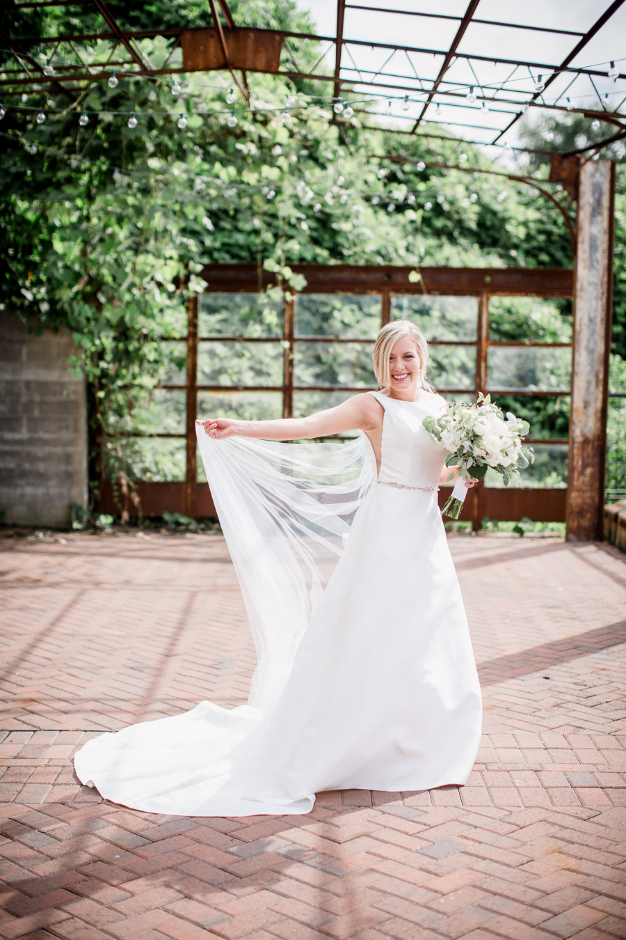 Bride twirling her cathedral veil at these 2017 favorite weddings by Knoxville Wedding Photographer, Amanda May Photos.