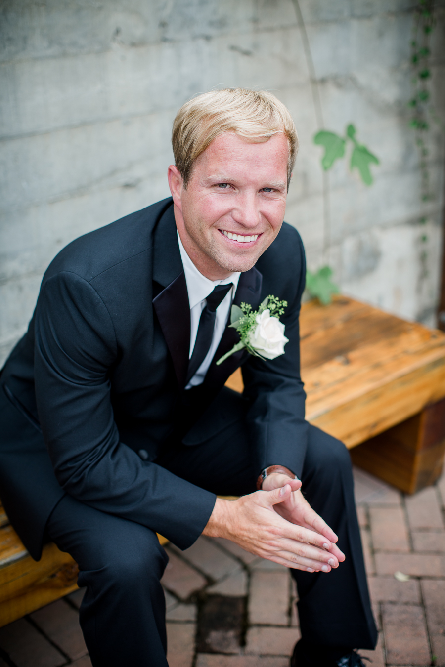 Groom sitting on a bench at these 2017 favorite weddings by Knoxville Wedding Photographer, Amanda May Photos.