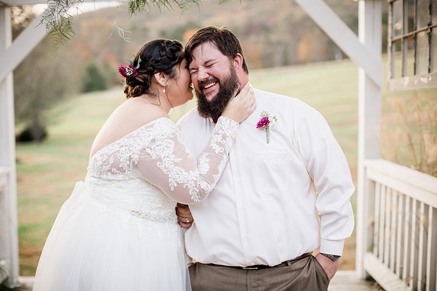 She whispers in his ear at these 2017 favorite weddings by Knoxville Wedding Photographer, Amanda May Photos.