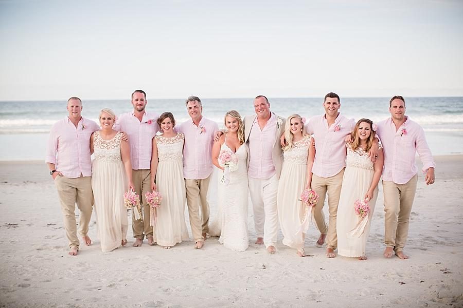 Groomsmen arms around the bridesmaids at these 2017 favorite weddings by Knoxville Wedding Photographer, Amanda May Photos.