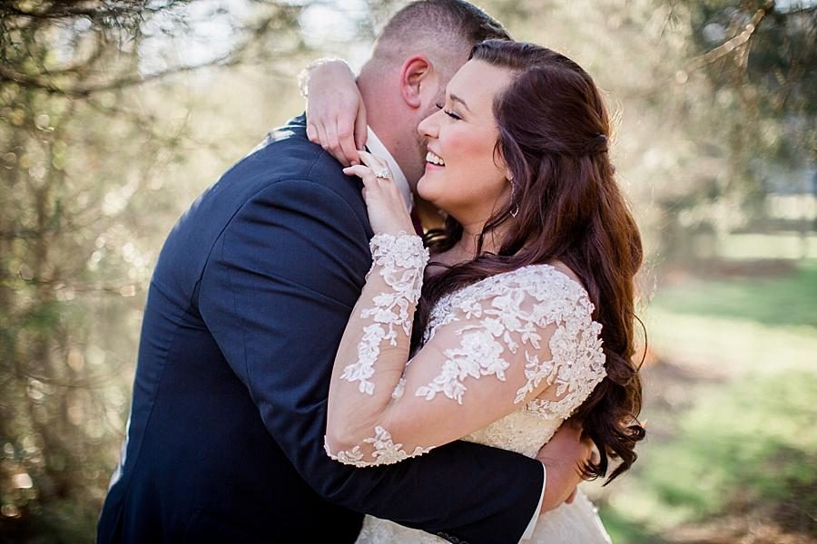 He whispers in her ear at these 2017 favorite weddings by Knoxville Wedding Photographer, Amanda May Photos.