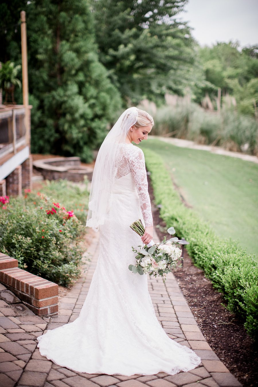 Looking down to her bouquet at these 2017 favorite weddings by Knoxville Wedding Photographer, Amanda May Photos.