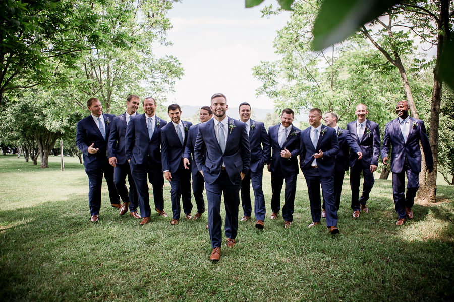 Huge groomsmen group walking at these 2017 favorite weddings by Knoxville Wedding Photographer, Amanda May Photos.