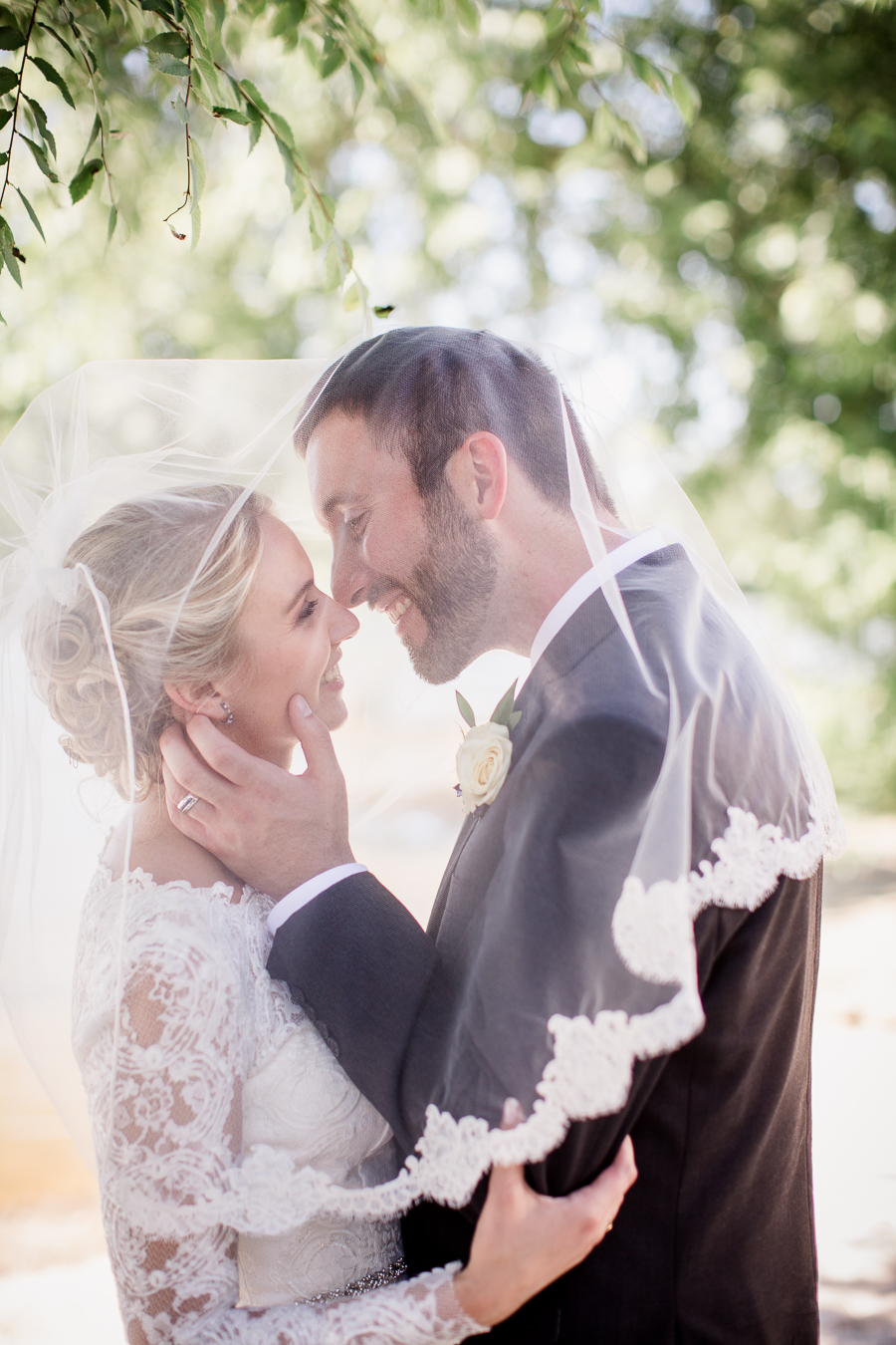 Kissing under the veil at these 2017 favorite weddings by Knoxville Wedding Photographer, Amanda May Photos.