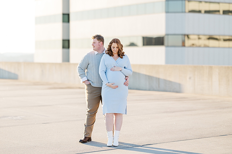 pregnant couple at golden hour