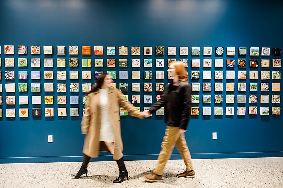 couple walking through art gallery