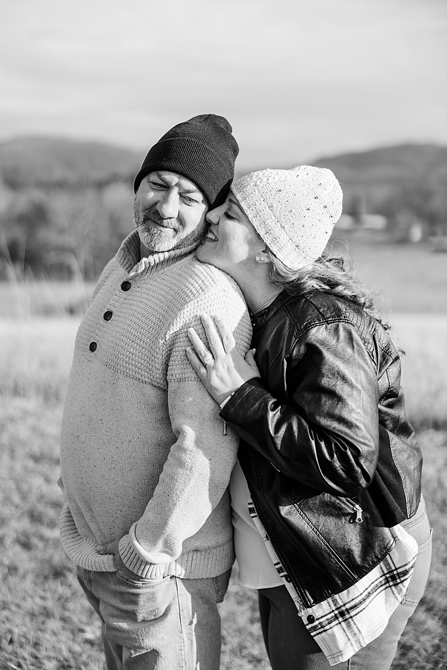 kiss on cheek with smoky mountain view in background