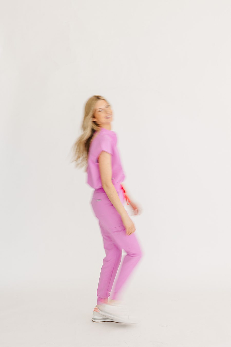 blurry photo of nurse in pink scrubs