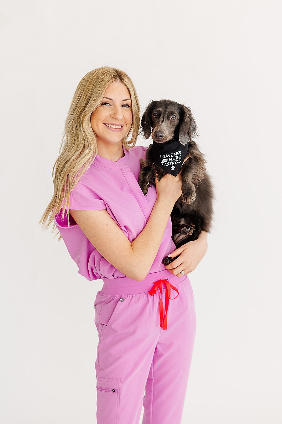 nurse holding long haired dog