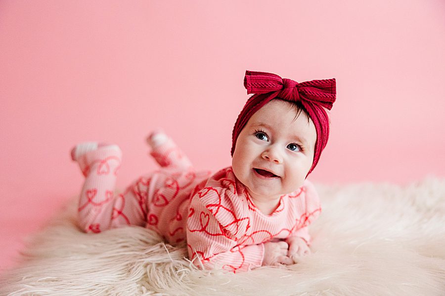 little girl laying on stomach