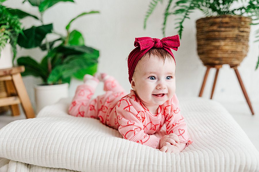 baby girl in red bow